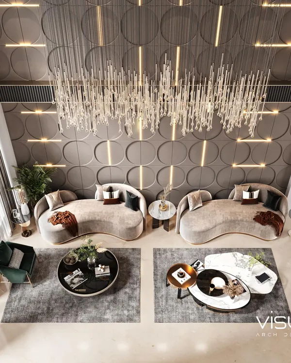 An aerial view of the duplex living room, showcasing the spacious layout, furniture arrangement, and the impressive scale of the crystal chandelier from above.