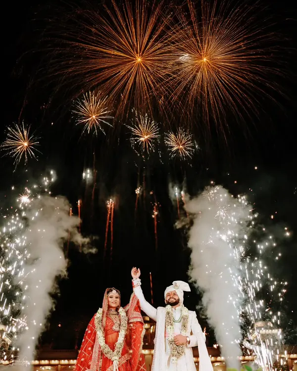 A spectacular wedding exit framed by an explosion of fireworks. We are experts at capturing these high-impact, dramatic moments.