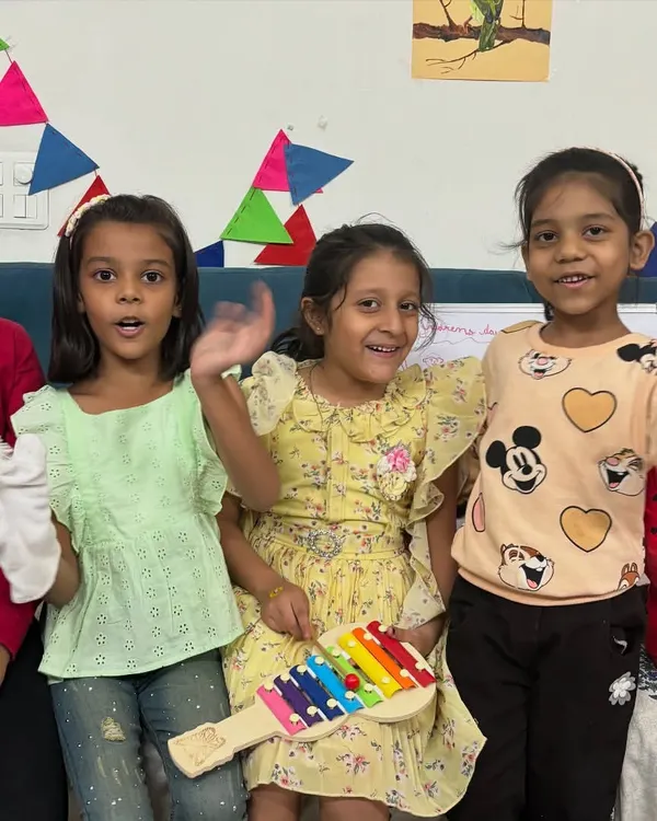 A happy group of campers showing off their handmade puppets and enjoying some music. Puppet making is a wonderful activity that leads to imaginative play and performance.