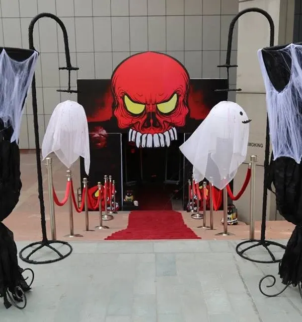 A powerful and spooky entrance designed for a Halloween event. The giant red skull, floating ghosts, and red carpet immediately set a haunted, high-impact tone.