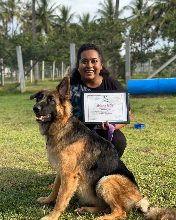 This was a dream come true. Here I am with my girl Bella, holding my professional dog trainer certification. I am proud to use my education to help you and your dog.