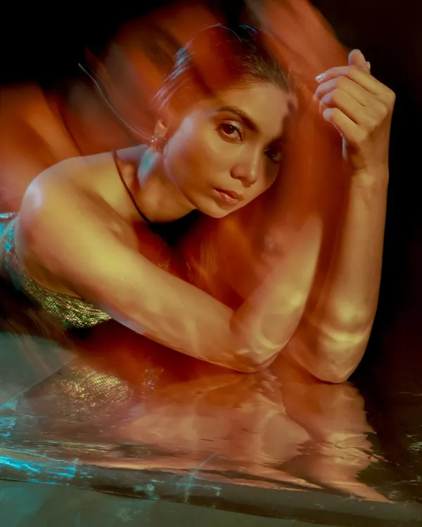 Another take from my long exposure series. I love how the motion blur creates a painterly effect, wrapping the model in warm, glowing light. This is perfect for an artistic or editorial shoot.