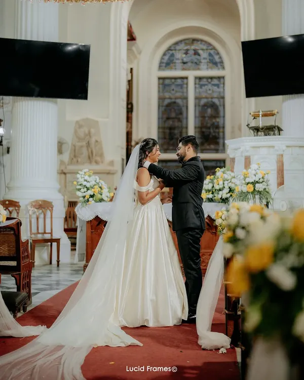 A sacred moment at the altar. We capture the grandeur of the church and the intimacy of the vows in our Christian wedding photography.