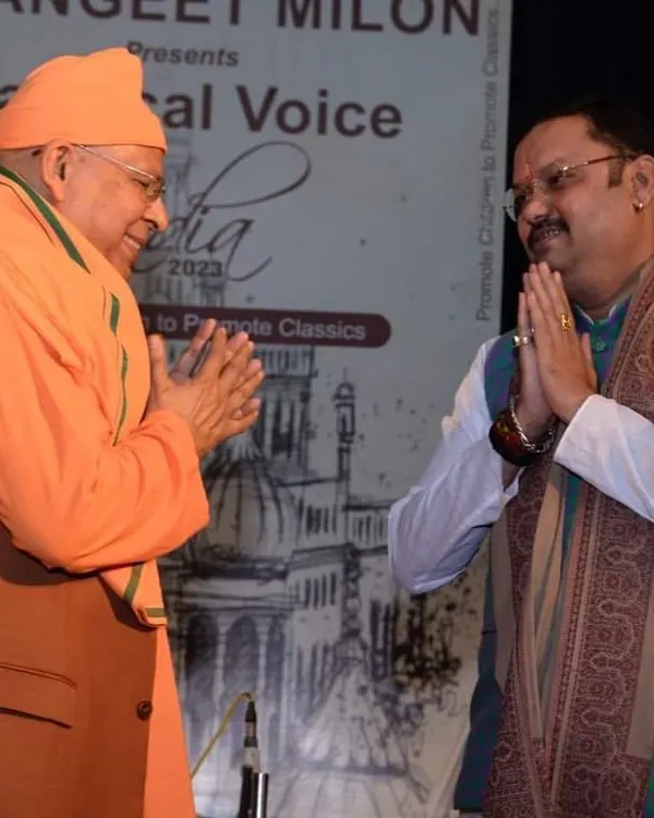 It was an honor to be on the judging panel for the Sangeet Milon Classical Voice of India music competition. Here I am sharing a moment of mutual respect with a senior artist at the event.