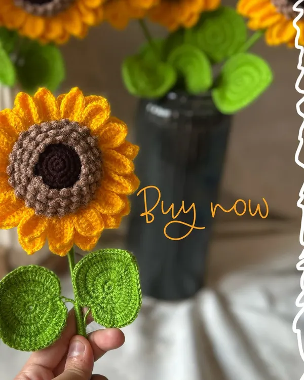 A single, handcrafted crochet sunflower, perfect for adding a pop of sunshine to any vase. The intricate details in the petals and center are all done by hand.