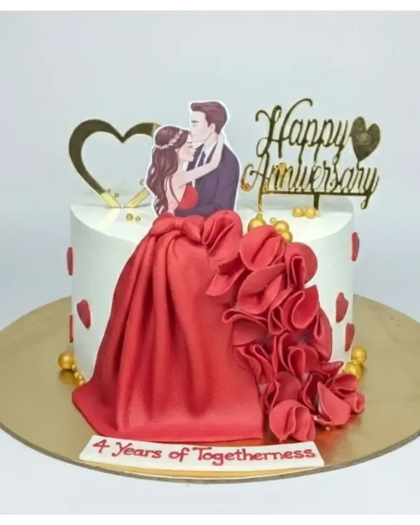 A stunning anniversary cake featuring a dramatic red fondant skirt. This is a rich, eggless chocolate indulgence truffle cake, perfect for celebrating four years of togetherness.
