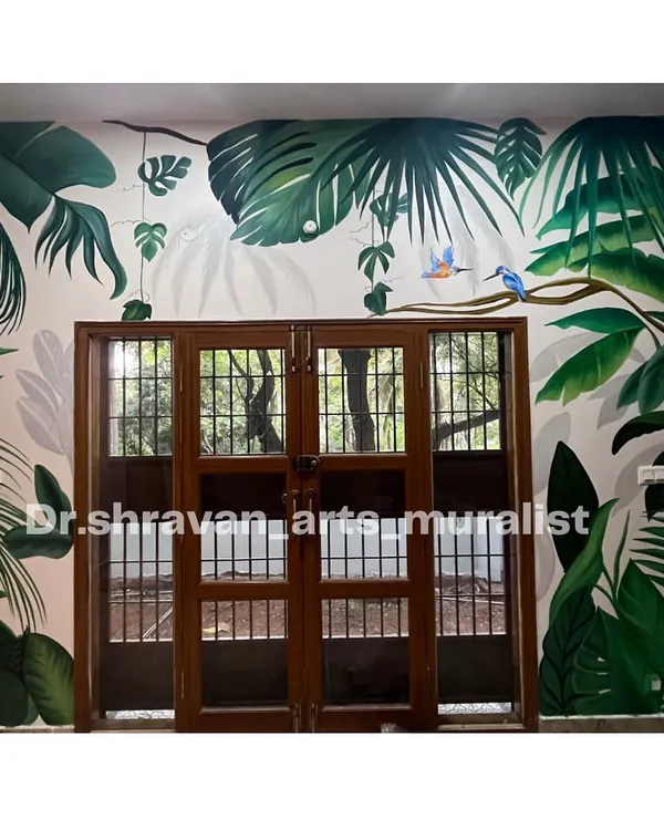 A beautiful tropical mural designed around a French door. The layers of leaves in different shades of green create a sense of depth, making it feel like you're looking out into a real jungle.