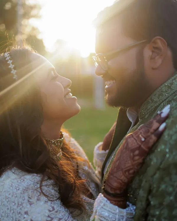 A beautiful, sun-kissed portrait from an engagement shoot. The golden light and genuine smiles perfectly capture the warmth and happiness of this special milestone.