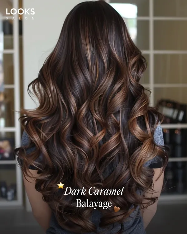 This is our Dark Caramel Balayage, a perfect example of how we create beautiful, low-maintenance color. We paint these tones by hand to complement your natural hair and skin tone, ensuring the color grows out gracefully without harsh lines. The result is a rich, dimensional look that is both stunning and easy to live with.