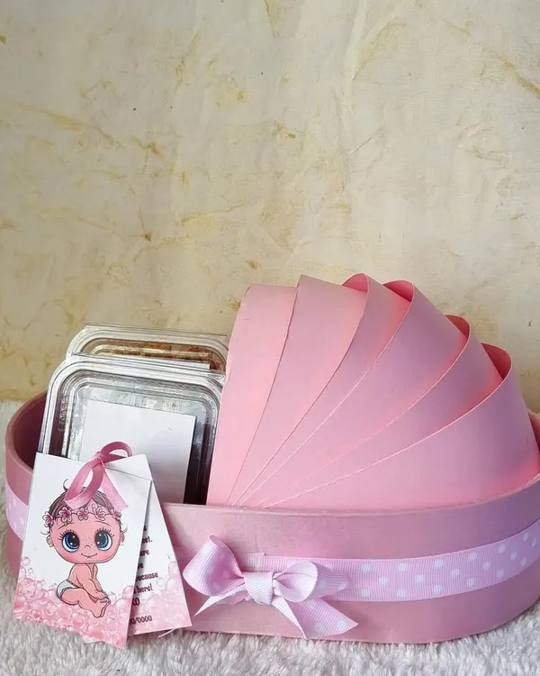 Announce your new arrival with this adorable pink bassinet-shaped hamper. It's a sweet and creative way to share your joy with friends and family.