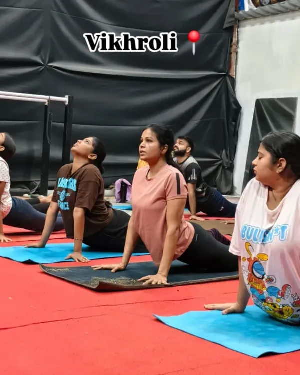 A group of our members in the cobra pose during a flexibility session. This is essential for improving spinal mobility and preventing back pain.