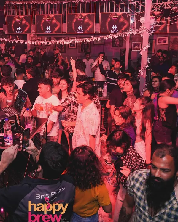 The crowd at Happy Brew is always ready for a party. The energy here is electric, with everyone singing and dancing together.