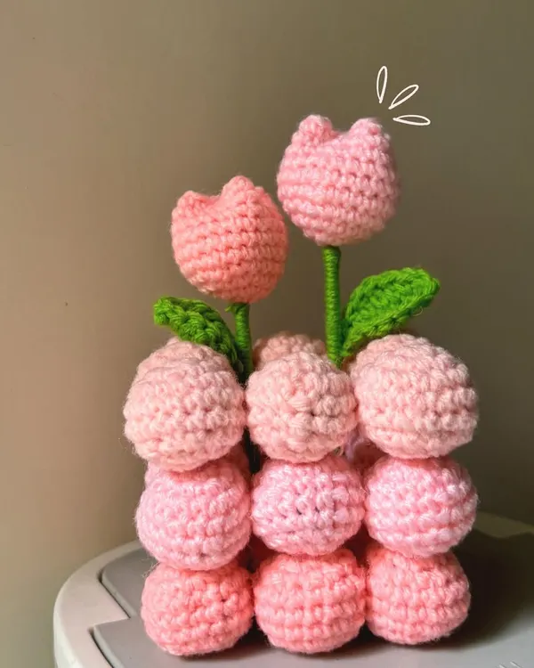 I went a little overboard and made a whole crochet tulip pot! This pot of pink tulips will stay in bloom forever.