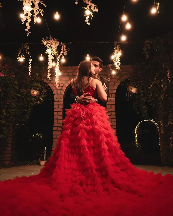 This stunning red ruffle gown is a favorite for pre-wedding shoots, especially for creating a romantic, movie-like feel at night. The endless layers of ruffles look incredible under lights, making it a true statement piece for your photoshoot.