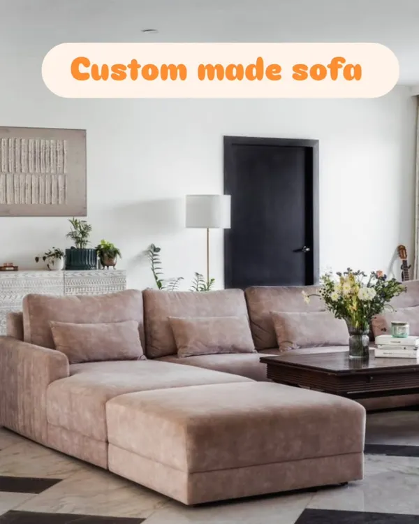 A custom-made L-shaped sectional sofa with a chaise lounge, designed to provide maximum comfort for the whole family. The soft fabric and deep cushions make it perfect for relaxing.