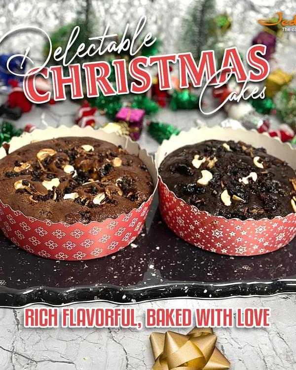Our delectable Christmas cakes are rich, flavorful, and baked with love. This image presents two individual plum cakes in festive red paper moulds, loaded with nuts and dried fruits for a truly indulgent holiday treat.