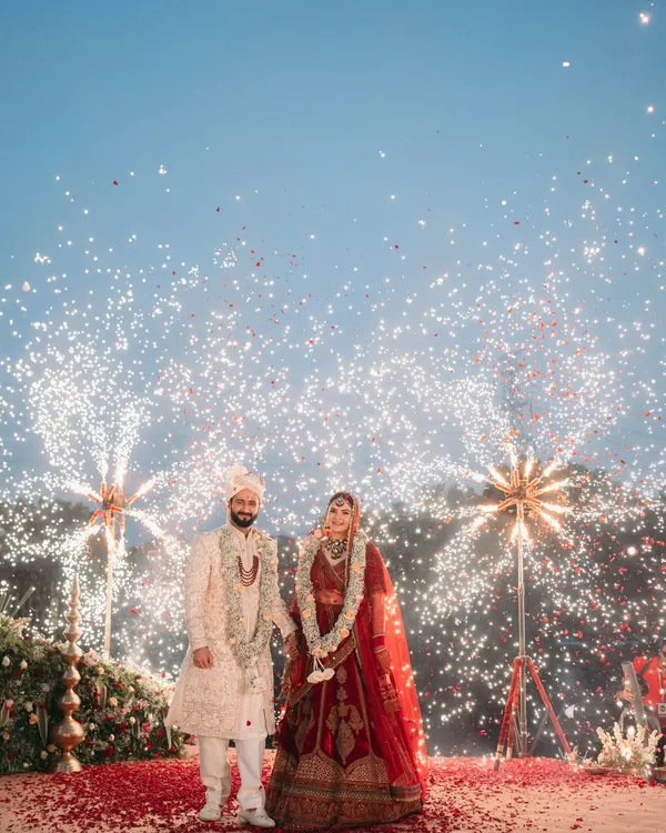 A varmala moment under a sky full of fireworks at Oleander Farms. I focus on creating these picture-perfect, dramatic moments that you'll remember forever.