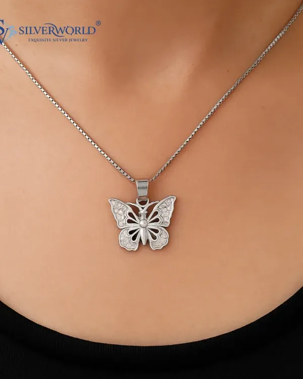 This delicate butterfly pendant is studded with pave-set zirconia stones on a classic silver box chain. It's a light and whimsical piece, ideal for daily wear or as a thoughtful gift.