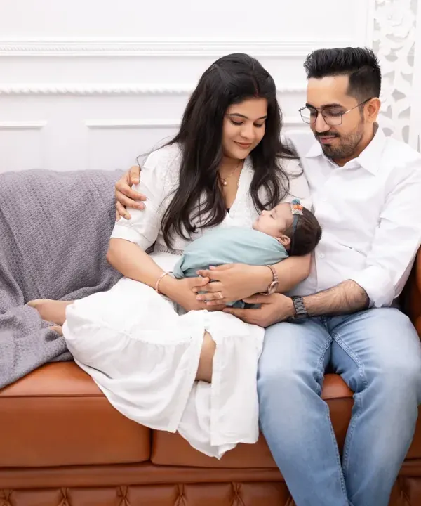 The first family portrait is a memory you will hold dear forever. We capture the pure love and connection as new parents hold their baby, creating a relaxed and intimate lifestyle session right here in our studio.