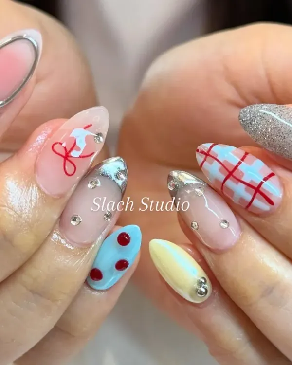 This is how we bring your personality to your fingertips. I created this custom nail art set on almond extensions, combining multiple trends like hand-painted plaid, 3D silver chrome details, delicate line art, and full coverage glitter for a truly one of a kind look.