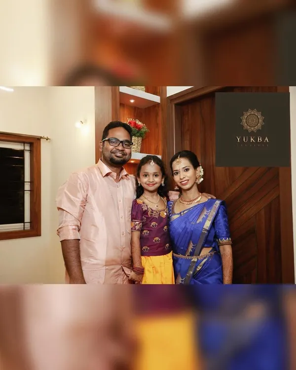 A beautiful family portrait. I had the pleasure of designing a matching embroidered blouse for the daughter, coordinating perfectly with her mother's royal blue saree.