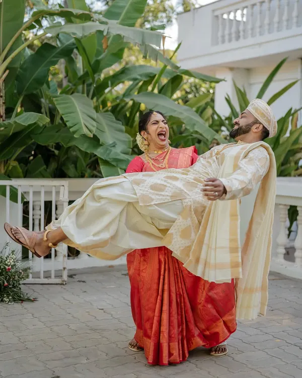 A power couple that knows how to have fun. We love capturing these playful, candid moments that show off your personality, like this bride effortlessly lifting her groom.