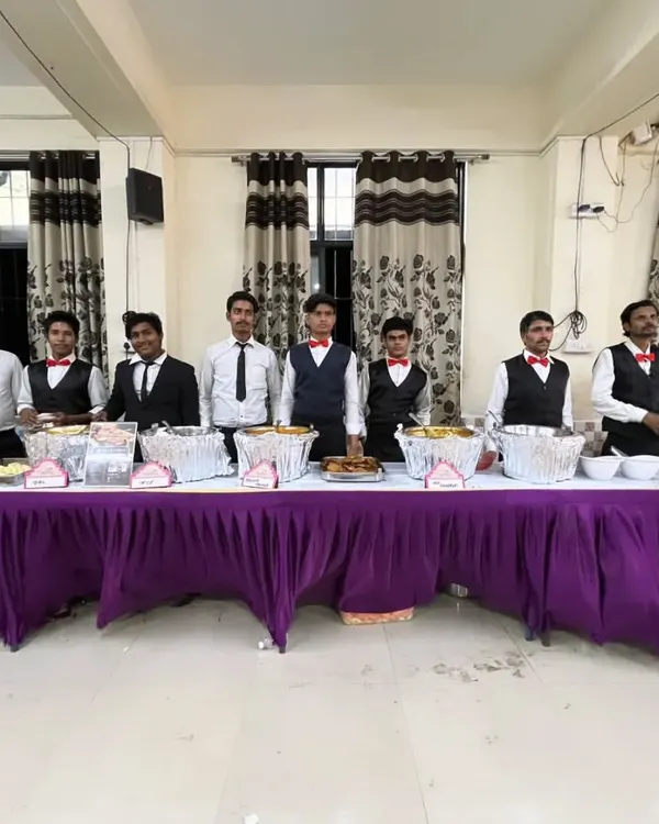 Our full team ready for service. They are trained to handle everything from food arrangement to serving guests, making sure your event is a success.