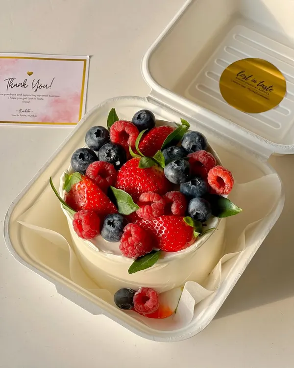 This is my signature berry-loaded bento cake, packed with fresh, seasonal strawberries, raspberries, and blueberries on a light buttercream base. It's a perfect example of how I combine great taste with beautiful, natural decoration.