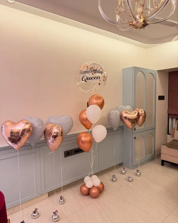 We love creating the perfect birthday aesthetic. This assorted balloon bouquet features rose gold hearts, a personalized "Happy Birthday Queen" bubble balloon, and a soft pastel color palette for a totally chic celebration.