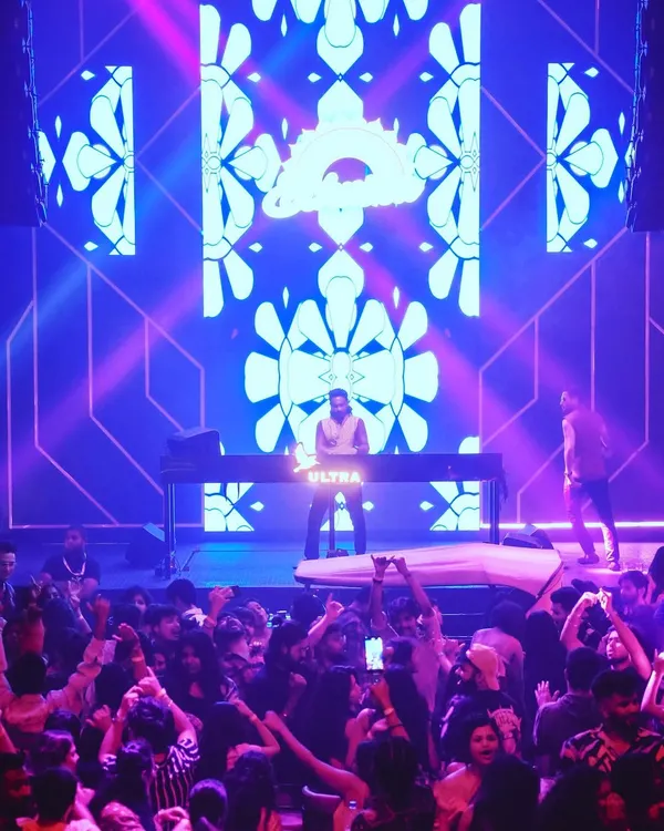 On stage during the 'Ethnika Experience' at Sunburn Union, backed by a full AV setup. I offer audio-visual DJ sets for public events to create a more immersive musical experience.