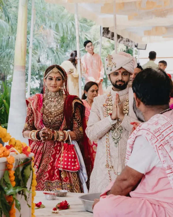 The couple seeking blessings from a priest at a temple. I can arrange for ceremonies in sacred spaces to add a layer of spiritual depth to your union.