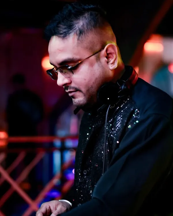 A black and white shot capturing my focus during a set. The sequined jacket adds a bit of sparkle to the intense concentration.