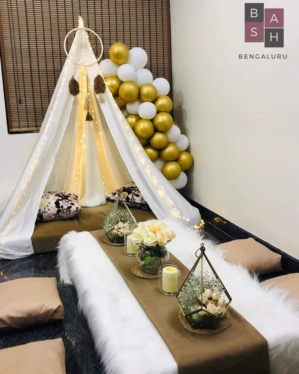We transform your space into a magical retreat with our signature chic canopy setup. This cozy teepee tent, complete with soft cushions, a low dining table, and warm fairy lights, is perfect for an unforgettable at-home date night or birthday surprise.