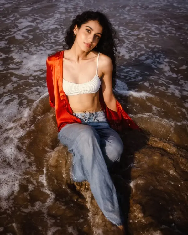 A serene moment with the waves washing over. This shot is all about the connection with nature, capturing a peaceful and therapeutic beach vibe.