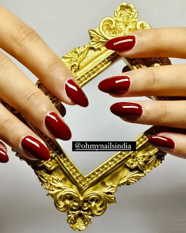A flawless set of classic red gel nails, shaped into a perfect almond style. This timeless and elegant look is one of our most requested services, ideal for any occasion that calls for a touch of sophistication.