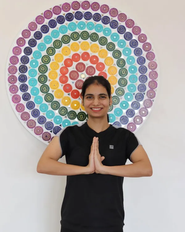 Our trainers are your motivators and mentors. Here, one of our dedicated instructors stands ready to guide you on your wellness journey.