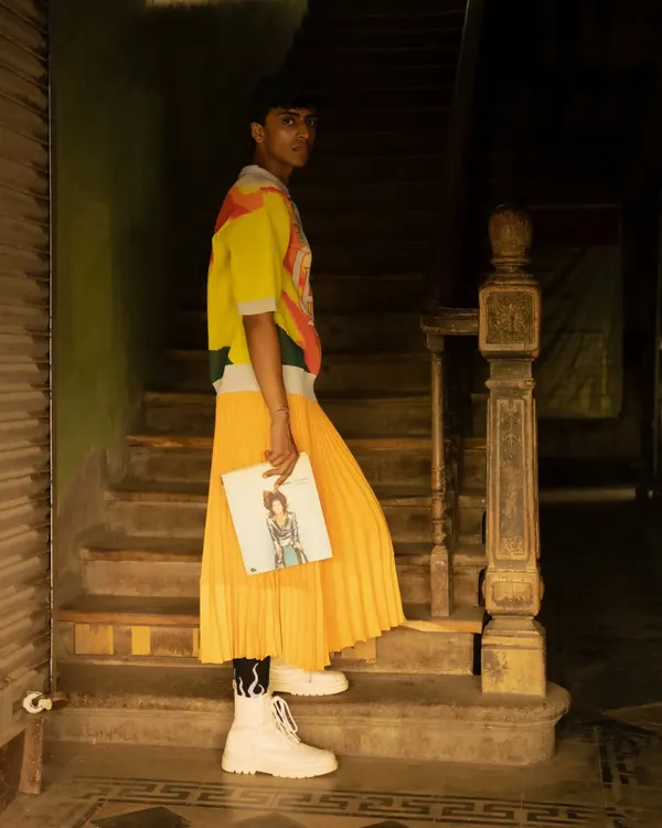 This fashion editorial shot was taken on the streets of Dadar market. I'll teach you how to direct a model with confidence in a crowded public space and how to edit the image to make the colorful outfit pop against the gritty background.