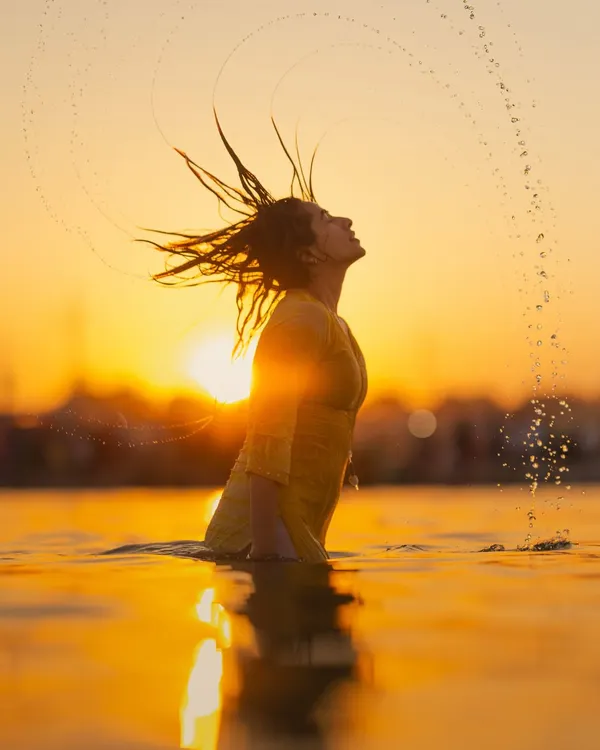 A moment of pure release and surrender to the elements. The Ganga has a way of washing away more than just the dust; it cleanses the soul. This is the feeling I hope to share, the freedom found in letting go.