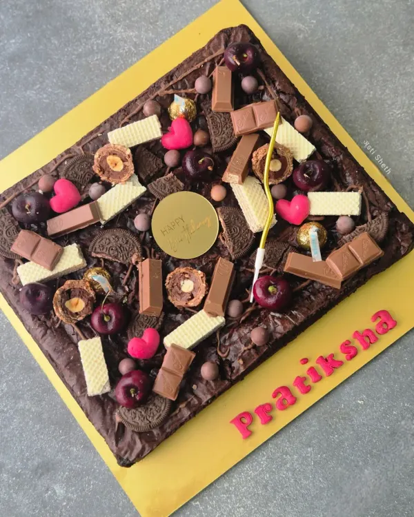 My fudgy and gooey brownie slab is a dream for any chocolate lover. Made with rich coverture chocolate, this egg-free brownie has a perfect crinkled top and can be customized with various toppings for birthdays and celebrations.