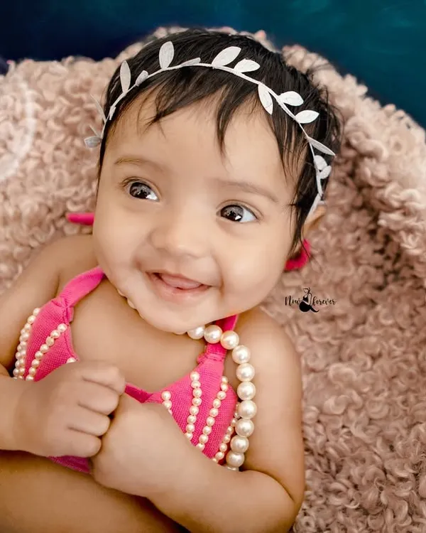 The sweetest smile from our little mermaid. Her joyful expression and the magical underwater theme make this a truly enchanting portrait.
