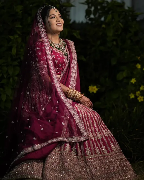 My bride Nandita looking absolutely radiant for her Varamala ceremony. I created a glamorous look with a hint of shimmer on the eyes to match her magnificent maroon lehenga.