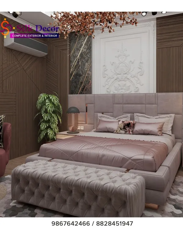 We designed this bedroom to be a true sanctuary. The centerpiece is a large, custom-upholstered bed in a sophisticated grey fabric, paired with a matching deep-tufted bench at its foot. This project highlights our ability to create coordinated bedroom sets that balance modern design with plush comfort.