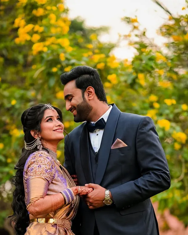 A classic romantic portrait of the couple against a backdrop of beautiful yellow flowers. We look for natural settings that complement your love story.