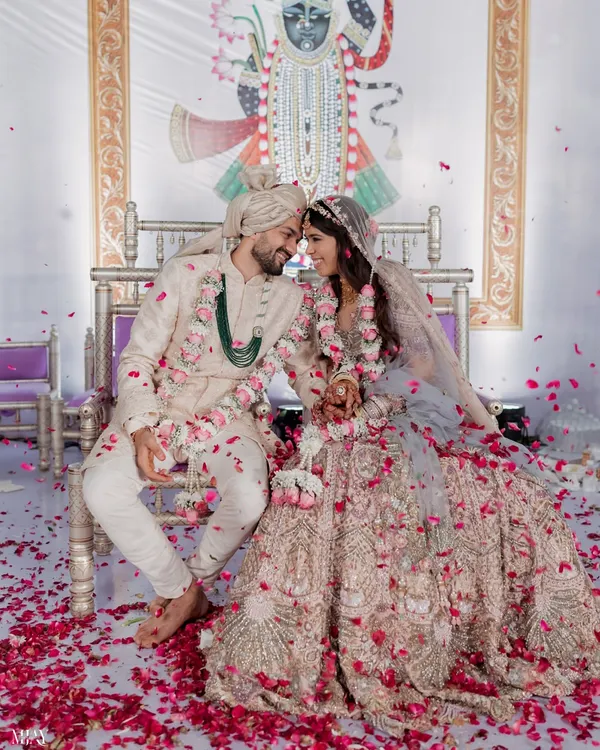 A moment of pure joy as the couple is showered with petals during their wedding ceremony at the beautiful ITC Maratha. We focus on capturing these candid, unscripted emotions that define your big day.