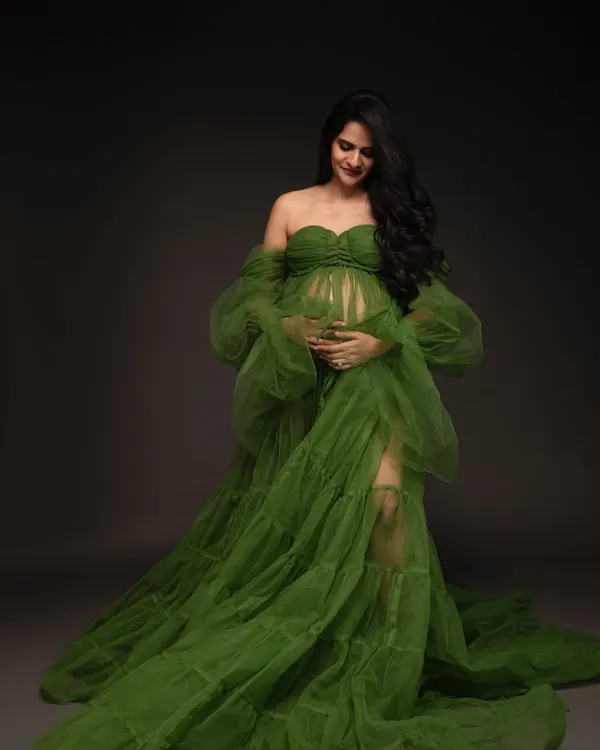 This is the magic we create together. I love using elegant, flowing gowns to celebrate your beautiful journey into motherhood, making you feel as radiant as you look.