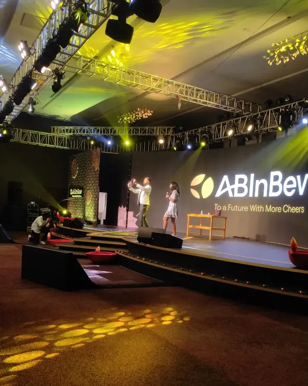 I thrive on stage, bringing a unique mix of hosting and magic to corporate events. Here I am, engaging with the audience at a lively Diwali celebration for ABInBev, ensuring the energy is high and the event is unforgettable.