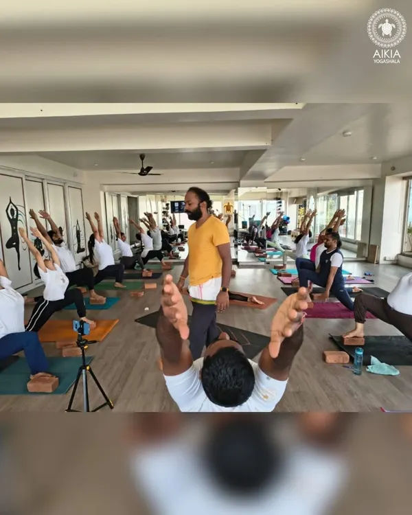 This is the energy of our shala. Here, we guide a full class through their practice, focusing on alignment and breath. We believe in creating a space where every student feels seen and supported, whether they are just starting or deepening their abhyas (practice).