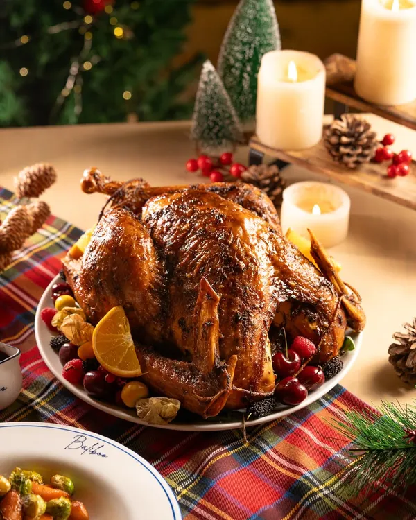 A magnificent roasted turkey for a Christmas feast. This is the quintessential hero shot for any holiday menu.