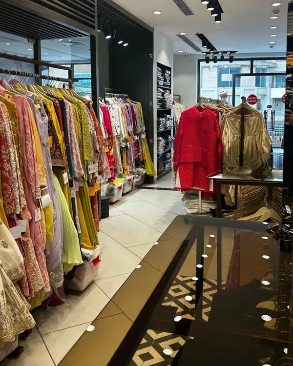 Welcome to my design studio in Gurugram. The store is filled with a colorful collection of ethnic wear, and I am here to help you find or create the perfect outfit for any occasion.