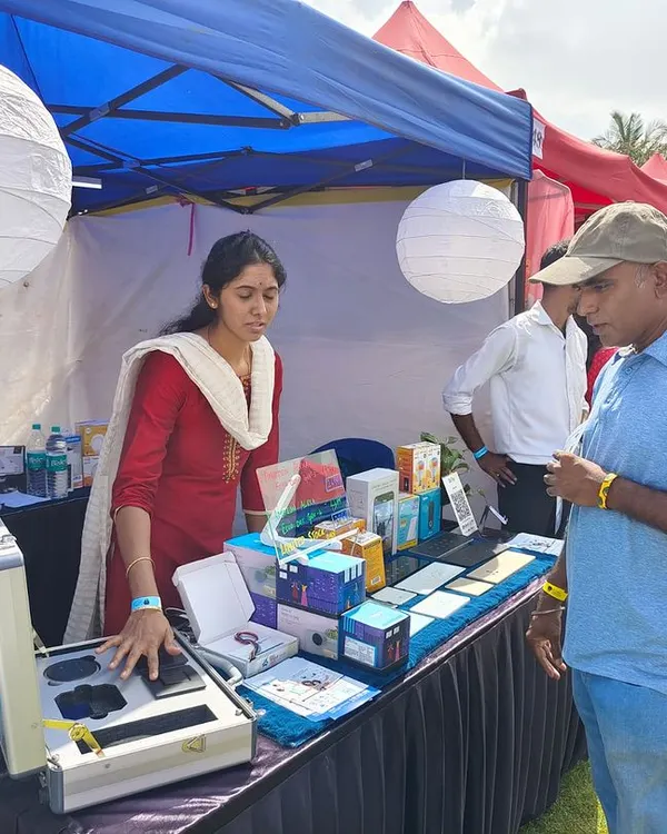 A member of our team provides a hands-on demonstration of our smart lock features to an interested visitor at a community event. We are always happy to answer questions and show how the technology works.